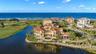 Located behind the exclusive North Gate of Hammock Dunes, this extraordinary Mediterranean estateoccupies one of the community’s most iconic peninsula