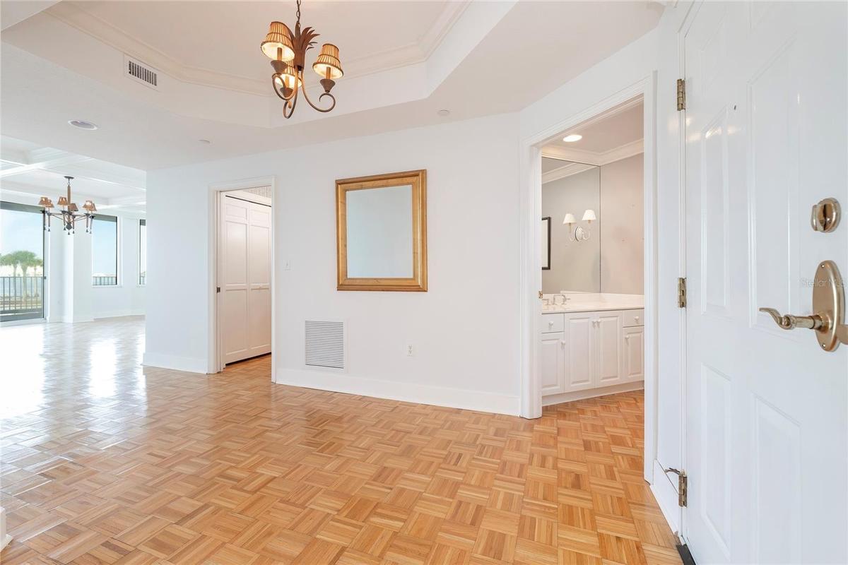 Foyer leading to Living Room (left) and Kitchen (right)