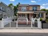 altered version of front of house photo via AI