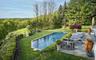 Rear landscaped garden with patio and salt water pool.