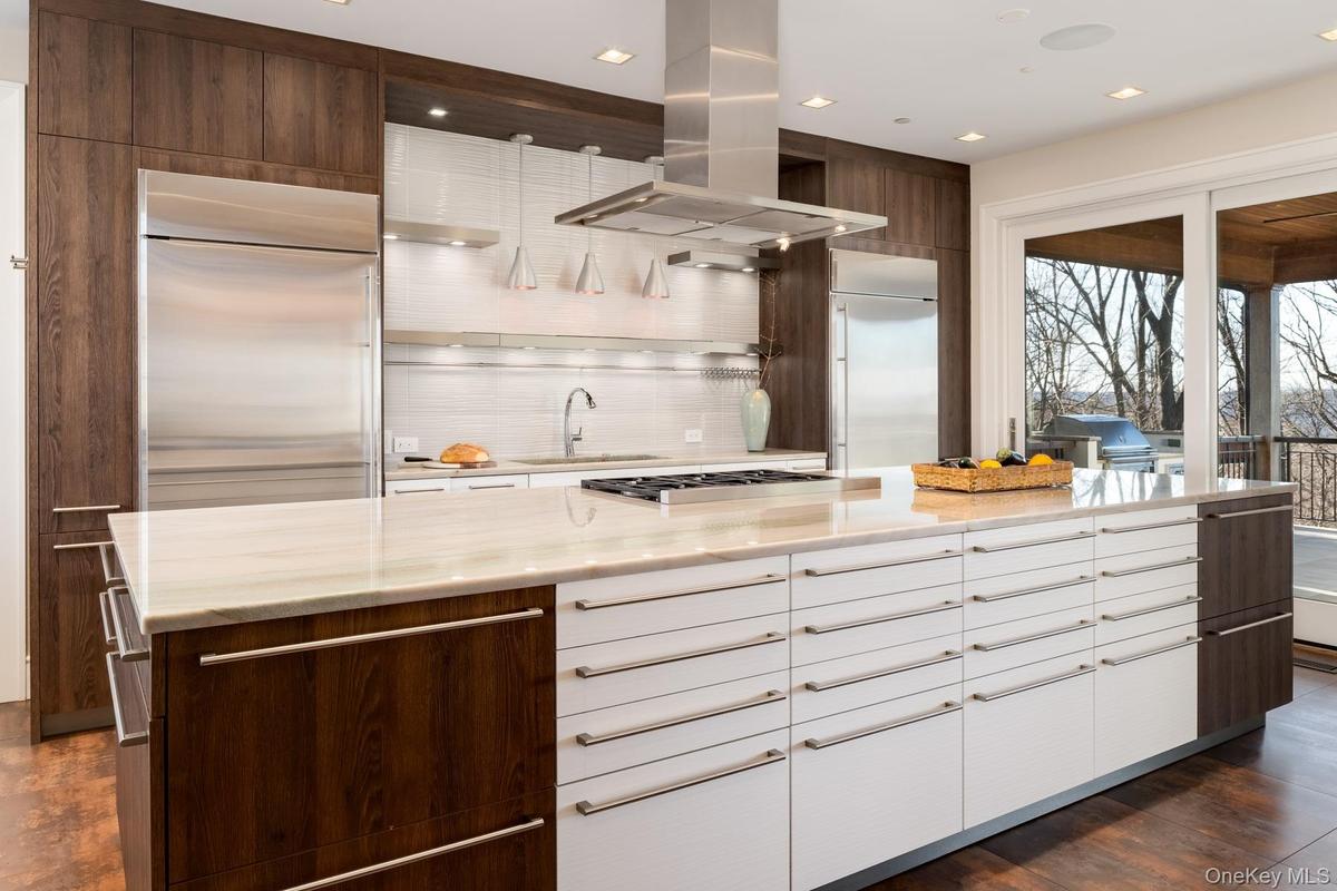 The gourmet kitchen, designed with European cabinetry and Quartzite countertops.