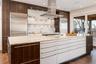 The gourmet kitchen, designed with European cabinetry and Quartzite countertops.