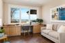 First floor guest bedroom with custom built-ins for home office.
