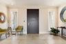 Elegant entry foyer enhanced with porcelain tile floors.