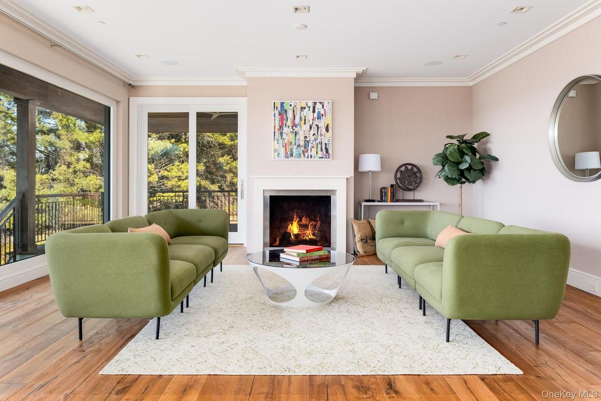 The grand room has Italian oak flooring and gas fireplace .