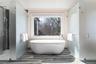 Primary bathroom with soaking tub and radiant heated floors.