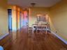 Dining area with sink and light wood-type flooring