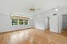 Primary Suite with new wood flooring, walk in closet, and private bath