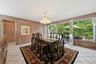 Formal Dining Room with Custom Panels, Built ins and French Doors to Patio