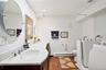 Full bath with ADA compliant walk in tub on entry level