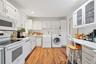 Kitchen with washer and dryer, which can be relocated to main lower level