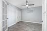 ... Main Floor Guest Bedroom #2 .. New Tile Floors - Closet and French Doors ..