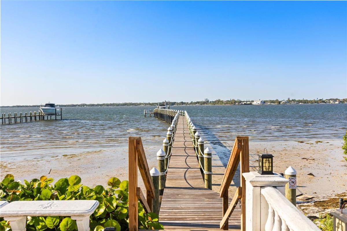 A 400-foot private dock leads you across the Manatee River, offering breathtaking views from this magnificent estate.