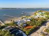 Sweeping northeast views overlook the Manatee River toward the Bradenton Yacht Club, offering a picturesque waterfront backdrop second to none.
