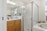 primary bathroom, shower, tub and water closet