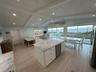 Huge sliding doors that open wide to the ocean.