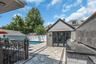Converted garage, easy to convert back. Finished tile floor, folding glass doors, sub panel electic service