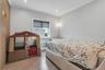 Light gray painted walls with white crown molding, electric blinds
