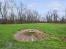 View of yard featuring an outdoor fire pit