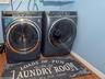 Laundry area featuring separate washer and dryer and hardwood / wood-style flooring