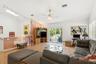 Living room with skylight over stairs and sliders to trex deck.