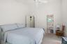 Upstairs Primary Bedroom to En Suite bathroom.