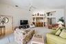 Large and open family room, ceiling fan.