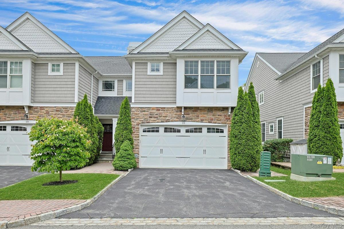 Elegant three-level townhouse in the sought-after Hidden Ridge community, offering a rare combination of elevator access to all levels, a two-car atta