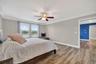 Primary Suite with LVP Floors, Crown Molding, Ceiling Fan, En-Suite Primary Bathroom, Windows Overlooking the View in Waterleaf Community! Enough Room