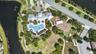 Aerial View of Amenities with Clubhouse, Resort Style Pool, Playground/Park, Sports Court, Dog Park, Walking Trails and Water View in Waterleaf Commun