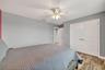 Bedroom #4 with LVP Flooring, Ceiling Fan, Built-In Closet, Accent Wall and Window Overlooing the Pond and View of Waterleaf Community!