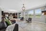 View from Windows to Tranquil Pond and Landscaping. Tons of Natural Light with Windows, Double Glass Sliding Doors, and Window from Kitchen Sink overl