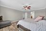 Primary Suite with LVP Floors, Crown Molding, Ceiling Fan, En-Suite Primary Bathroom, Windows Overlooking the View in Waterleaf Community! Enough Room