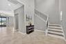 Foyer with View of Entry, Flex Room, and Staircase