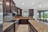 Cooking and Entertaining with a VIEW! Full Gourmet Kitchen with Crown Molding, Island, Pendant & Recessed Lighting, Abundant Cabinets with Crown Trim,