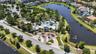 Aerial View of Amenities with Clubhouse, Resort Style Pool, Playground/Park, Sports Court, Dog Park, Walking Trails and Water View in Waterleaf Commun