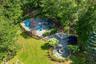 Drone / aerial view of a pool and patio