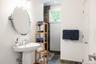 Full bath with stone finish floors and a shower
