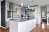 Kitchen with stainless steel appliances, island, and granite countertops