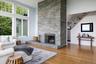 Living room featuring cathedral ceilings and bluestone fireplace.