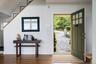 Foyer entrance featuring healthy amount of natural light and wood finished floors