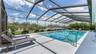 Screened-in pool and covered back porch area