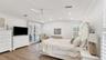 Primary suite with sliding doors to pool area.(previously staged)