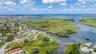 Aerial view of property looking West towards Gulf with deep channel access