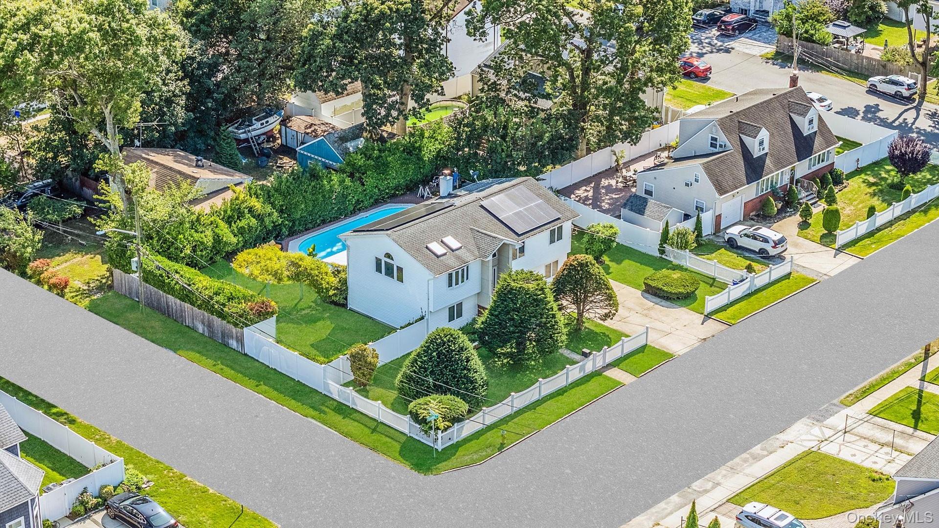 Aerial view of residential area featuring a pool
