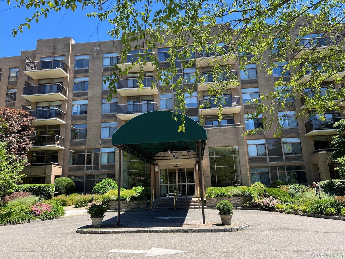 35 North Chatsworth Avenue 1J. Multi-story building featuring a brick exterior and a covered entryway