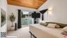The primary suite features vau