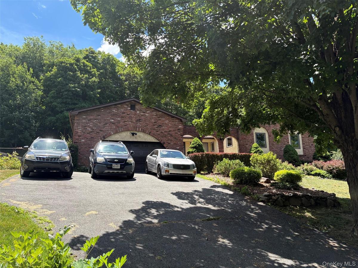 There is a garage and parking on the driveway