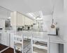A Galley style kitchen is open through the breakfast bar so you can still see that amazing view....