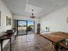 The ground level bonus room with sliders to the pool